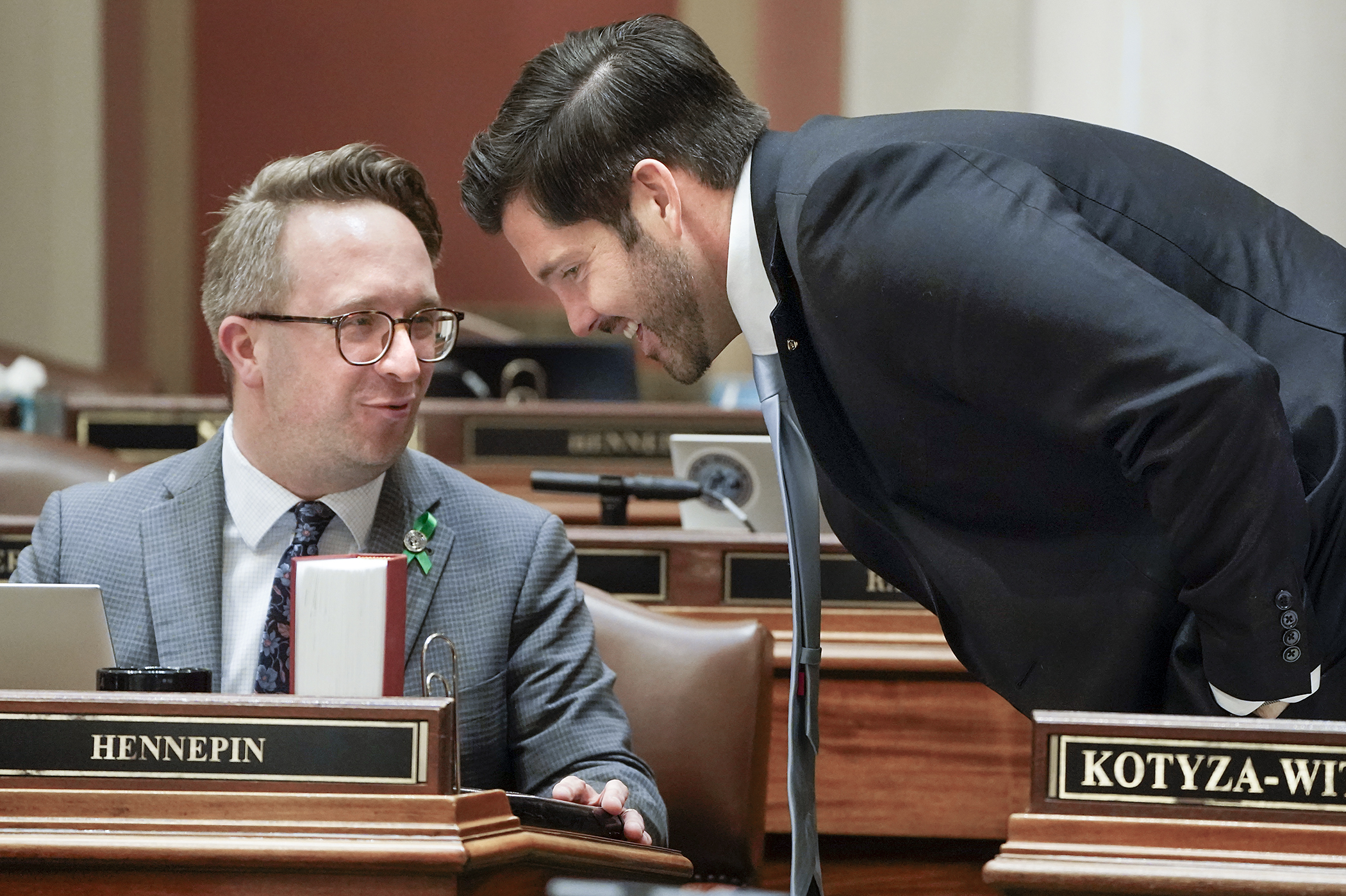 House Higher Education Finance and Policy Co-Chair Rep. Dan Wolgamott, right, and Co-Vice Chair Nathan Coulter confer during Monday’s debate on HF4252, the higher education supplemental finance and policy bill. As amended, the bill passed 82-52 and heads to the Senate. (Photo by Michele Jokinen)